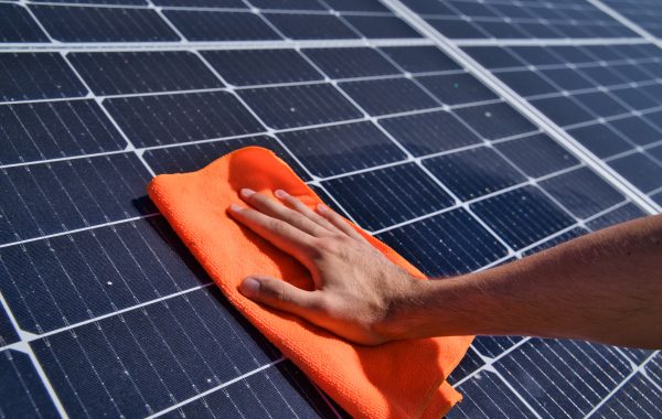 Cleaning,Of,Solar,Panels.,Hand,Wipes,Solar,Panels,From,Dirt.